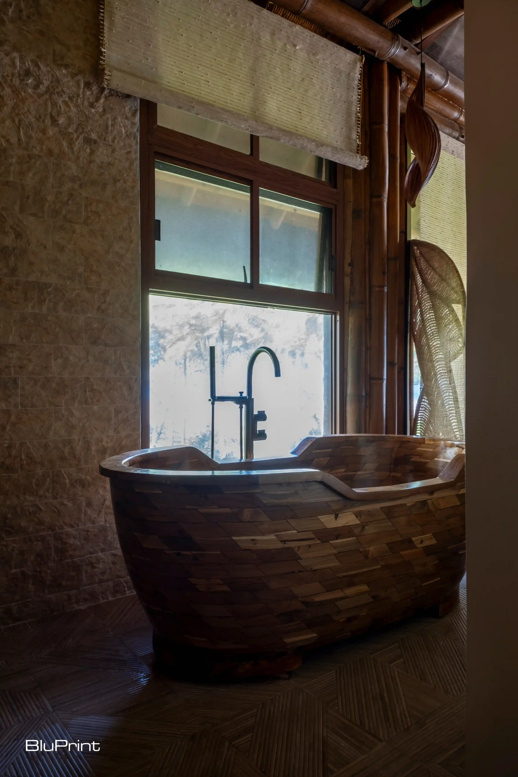 A Balinese wooden tub by the window.