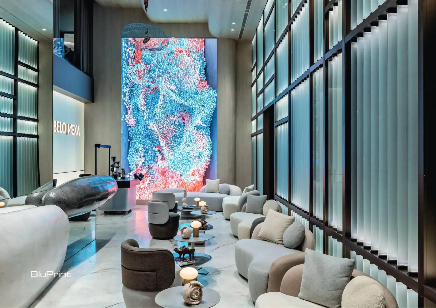 A striking floor-to-ceiling LED wall in Belo Nexa projects an immersive fusion of art and technology with ever-evolving, AI-generated projections.
