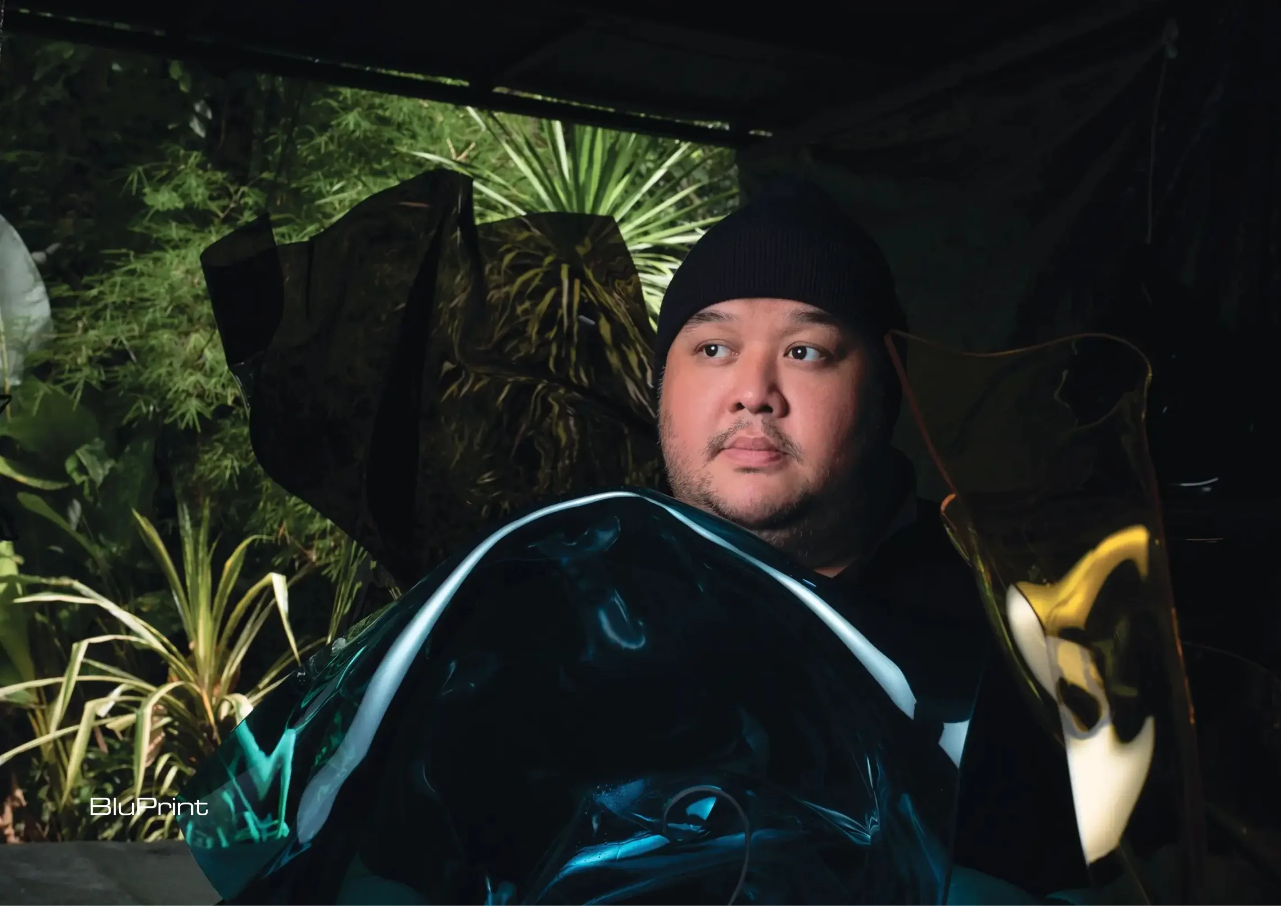 Image of Chino Yulo with some of his artworks.