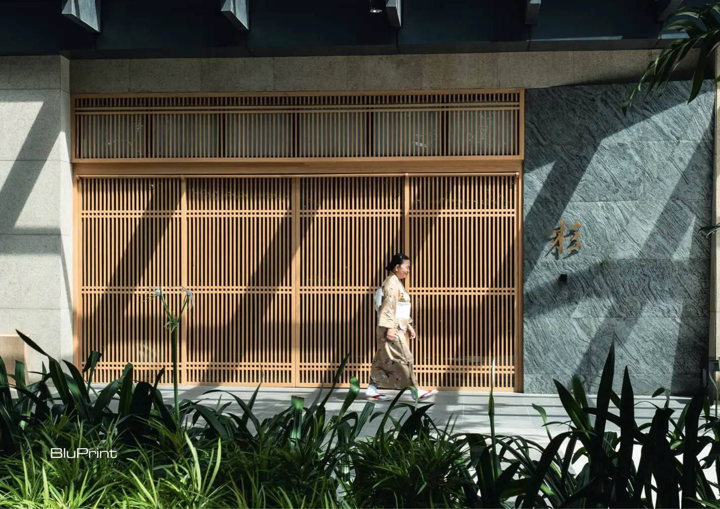 The entryway was designed to create a sense of arrival where guests are greeted by a water feature, a signature element from previous locations of Sugi Japanese Restaurant.