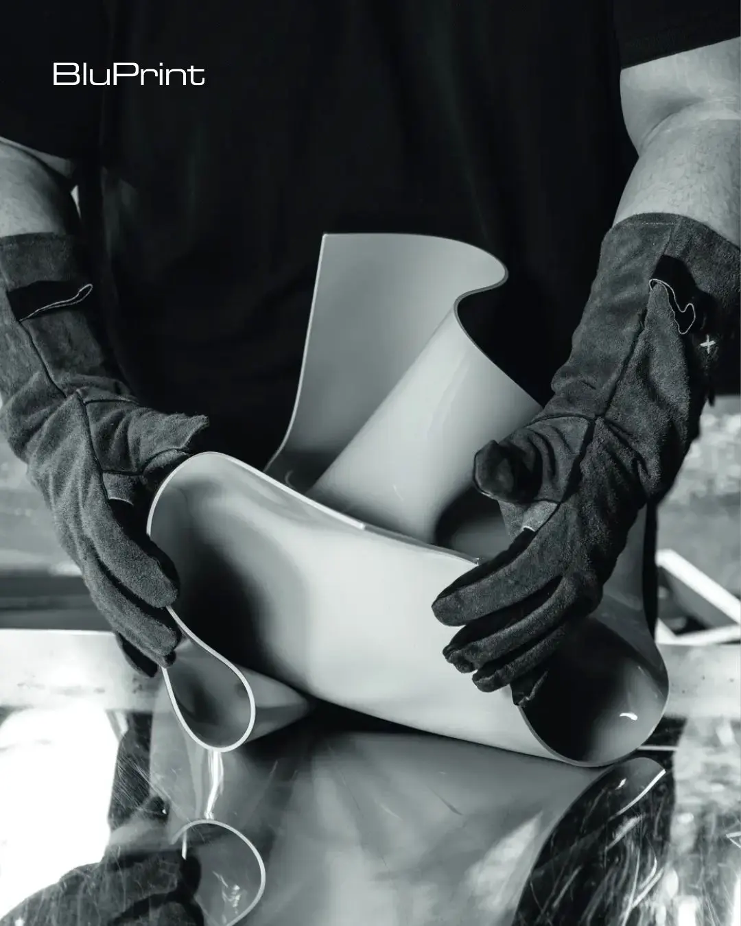 Chino Yulo molds the acrylic material with his hands, creating the unique shapes for which he is known.