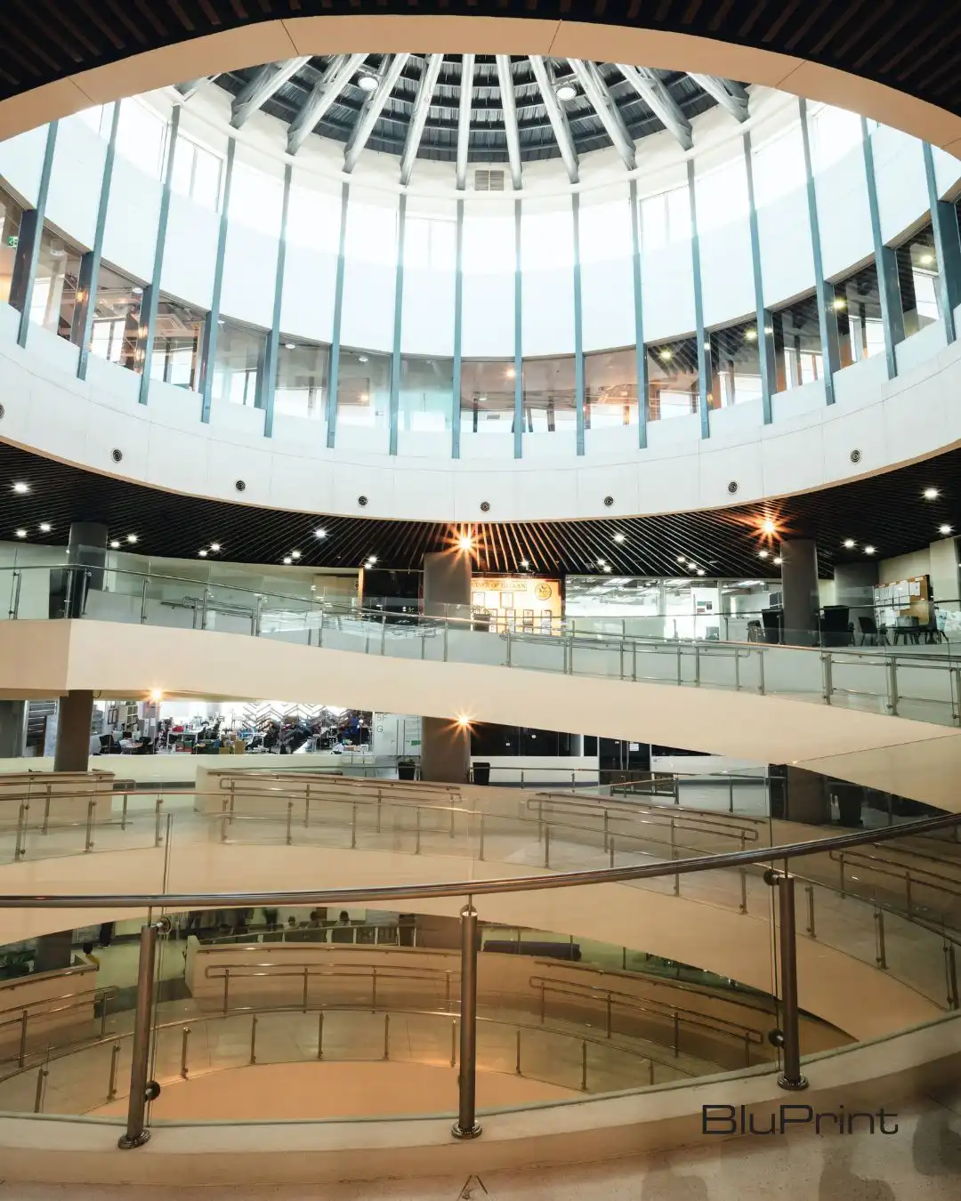 The Bunker corridor’s linear ceiling draws the eye toward the atrium, creating a visual connection between the periphery and the heart of the structure.