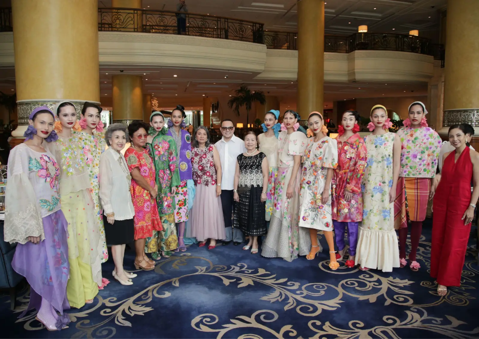 Jor-el Espina in the center with the models of his Patis Tesoro-inspired line and the founders of ArteFino.