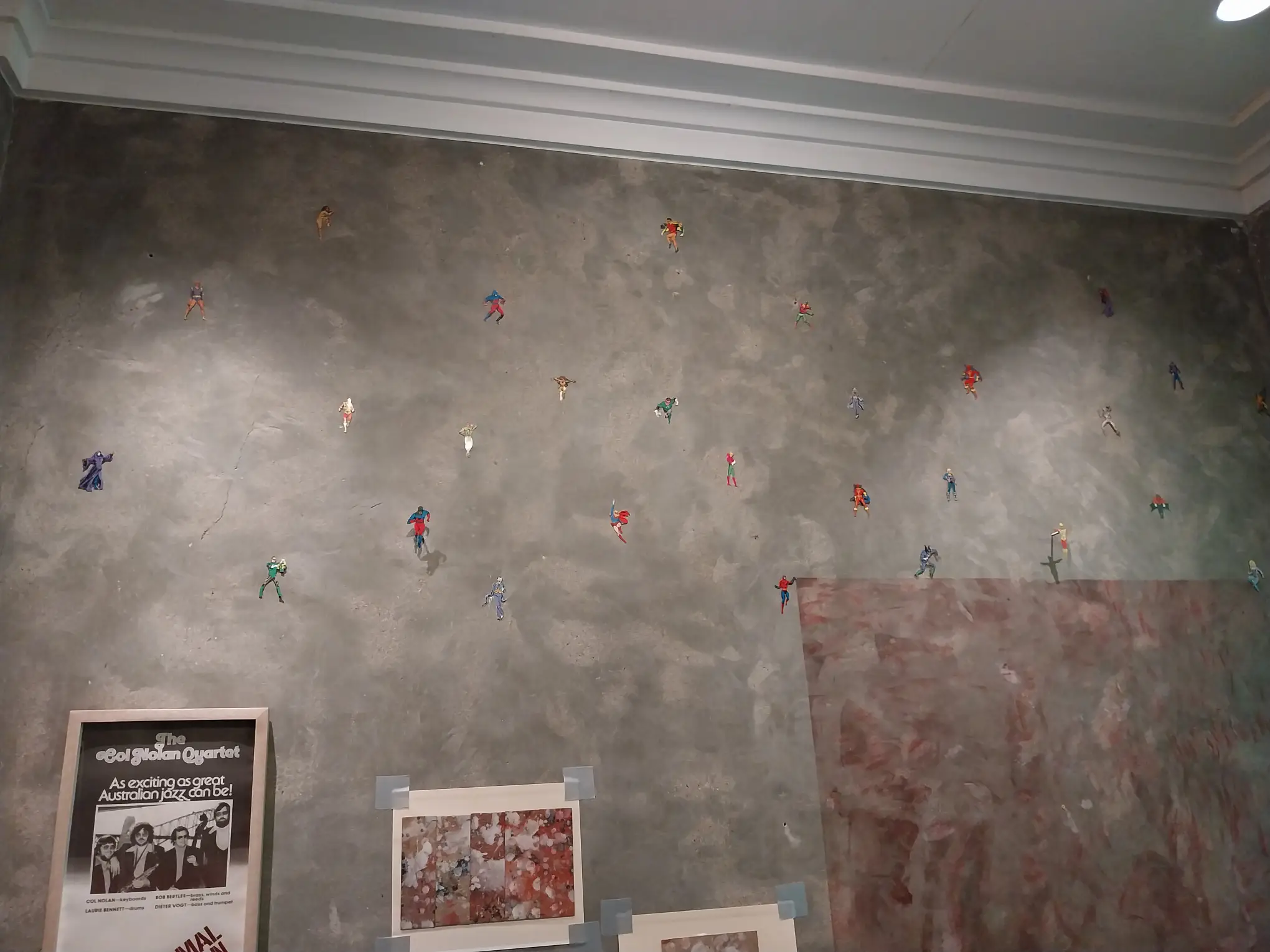 Superhero stickers in the walls of one of the rooms of "Early Philippine Contemporary Art" at Calle Wright.