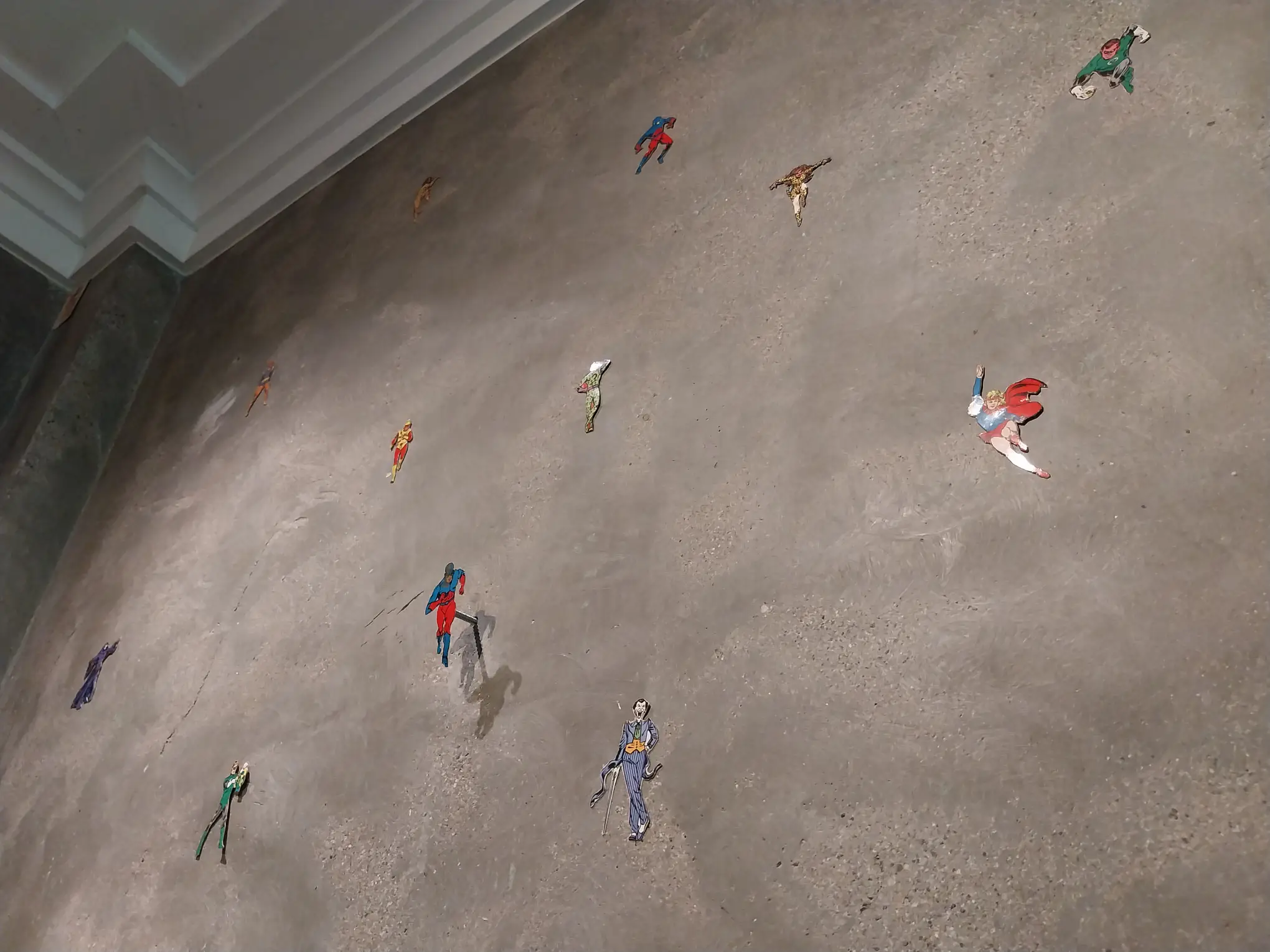 Superhero stickers in the walls of one of the rooms of "Early Philippine Contemporary Art" at Calle Wright.