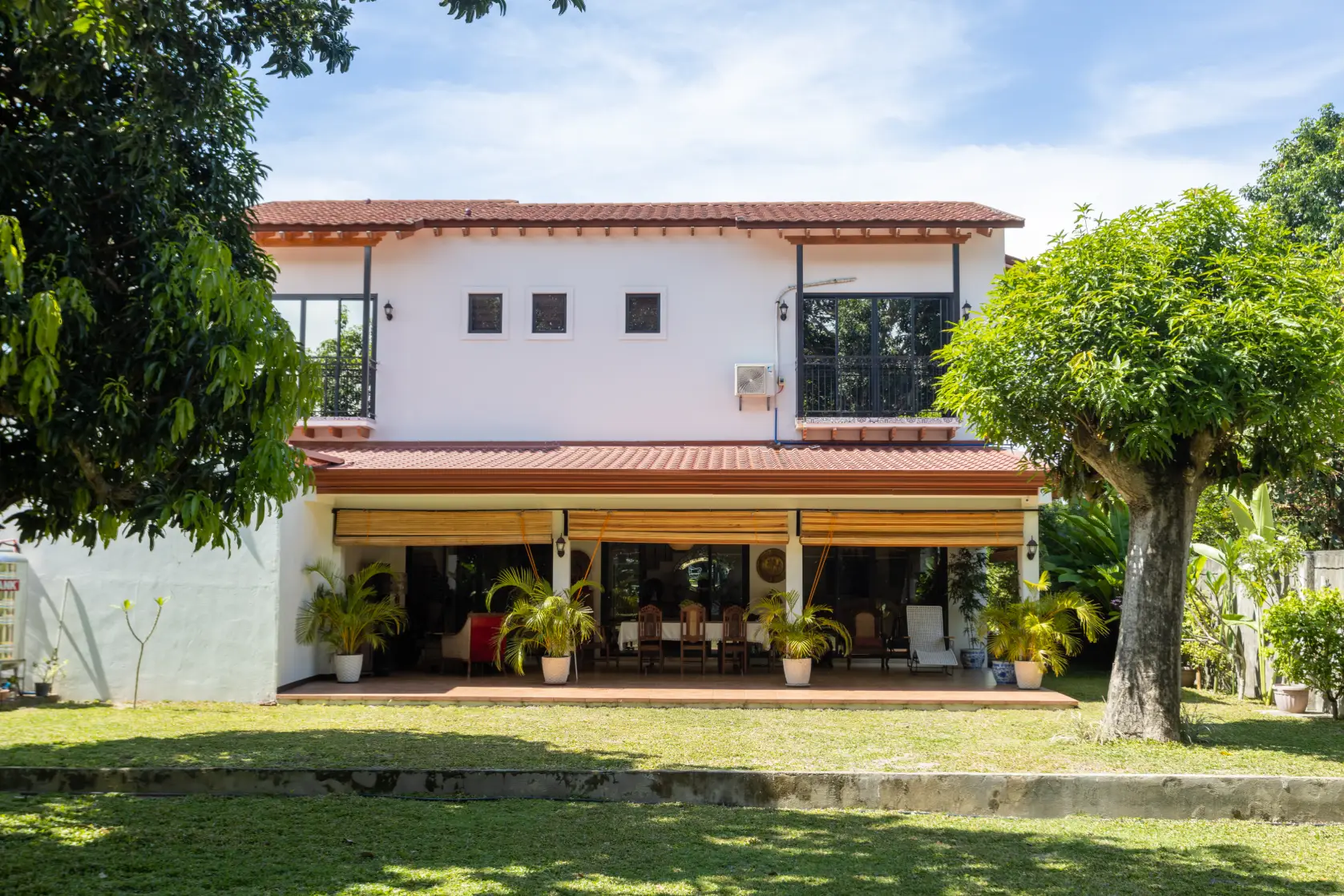 Set on a long, narrow lot, Casa Diago was carefully designed to preserve existing mango trees, resulting in generous front and rear gardens that offer both privacy and green space.
