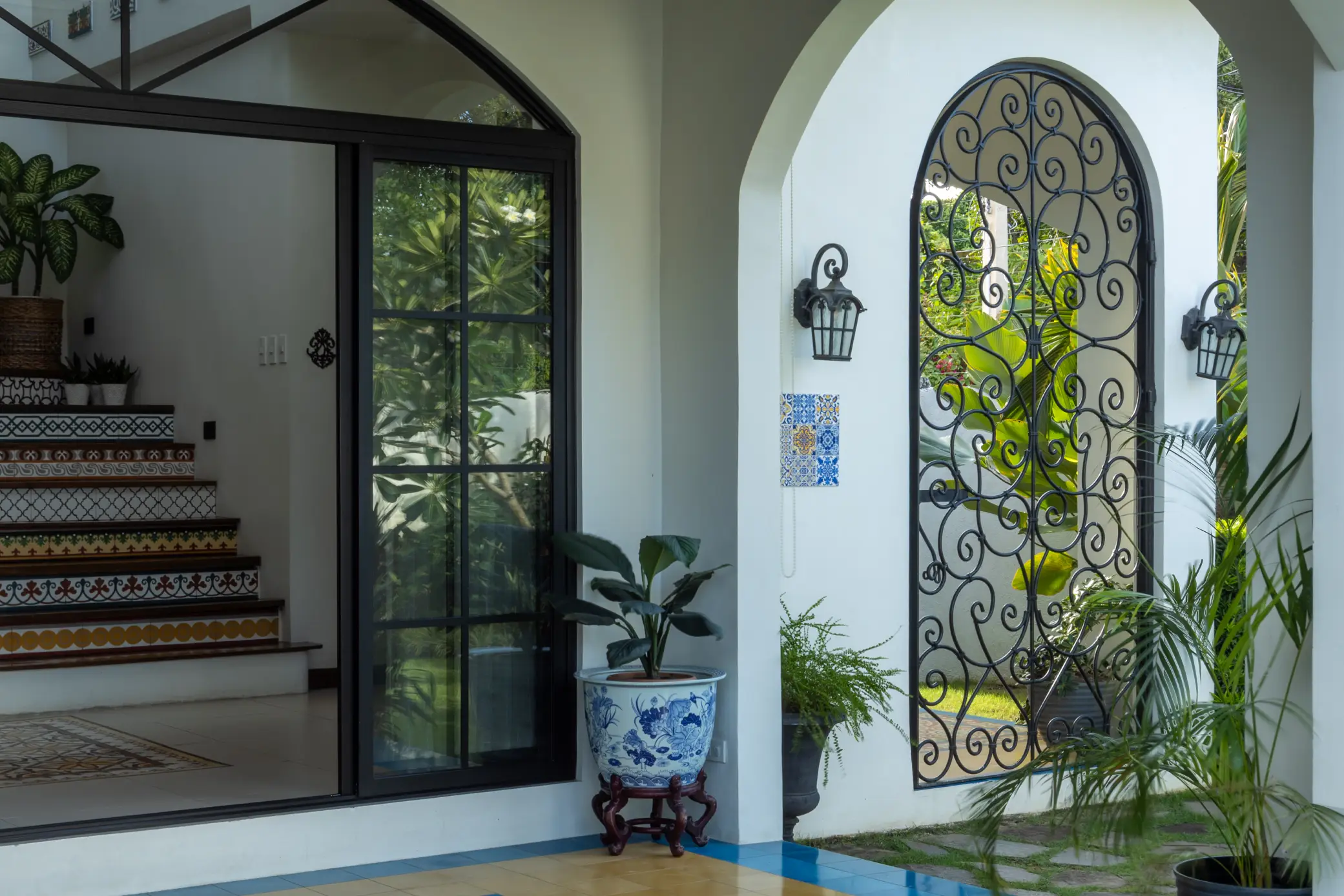 Glass sliding doors at Casa Midterranea allow for a seamless transition between indoor and outdoor spaces.