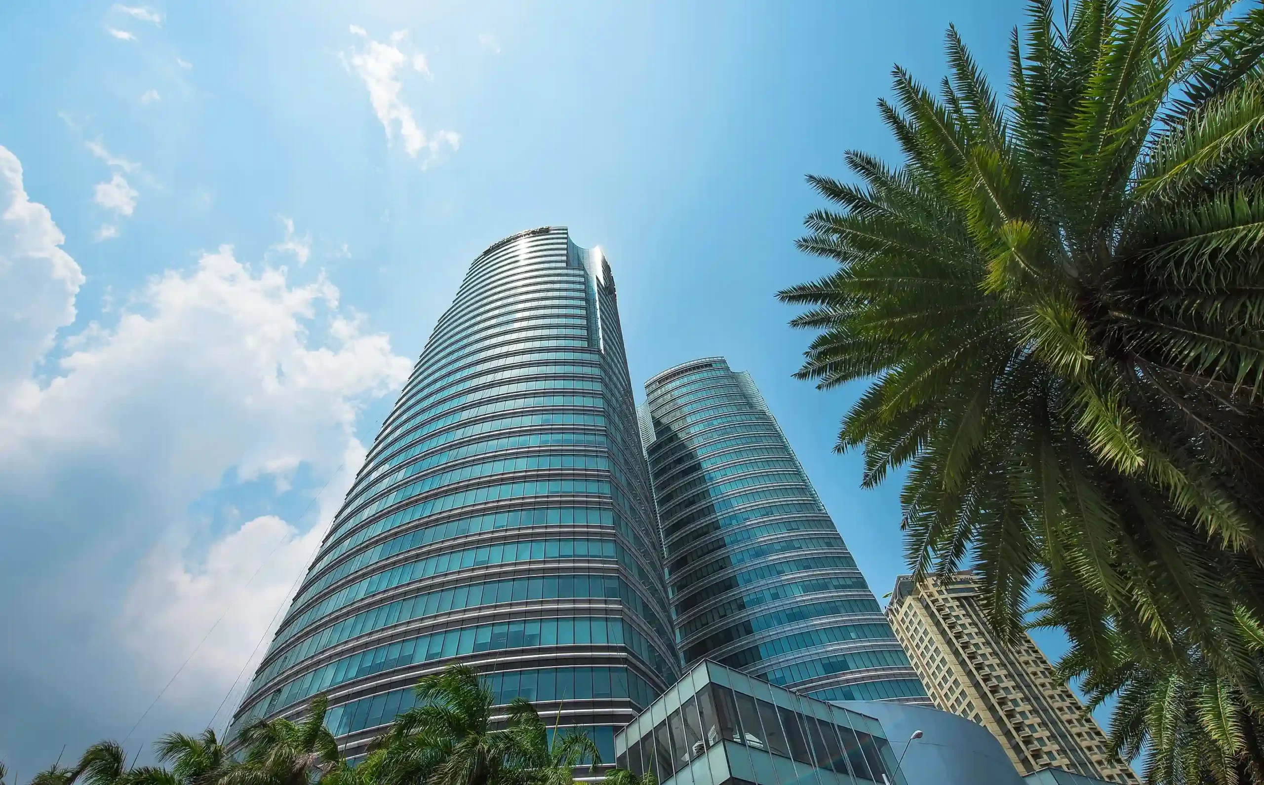 The crystalline facade of the Insular Life Corporate Center in Alabang reflects the company's identity of stability and modernity. The LEED-certified design articulates a forward-thinking corporate vision rooted in sustainability.