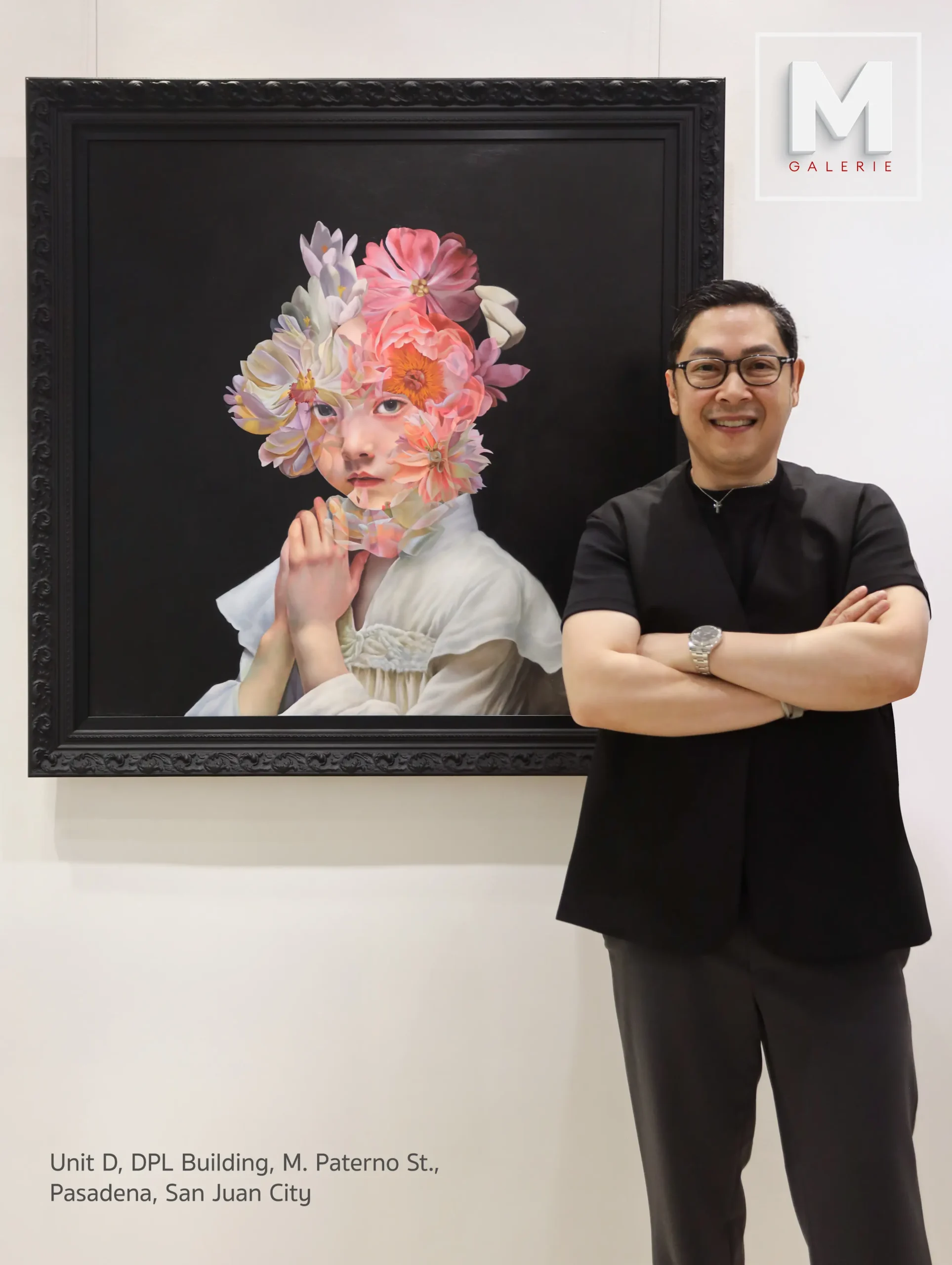 Founder Mykee Martinez in front of one of the artworks for "CONTINUUM," the anniversary exhibit of M Galerie.