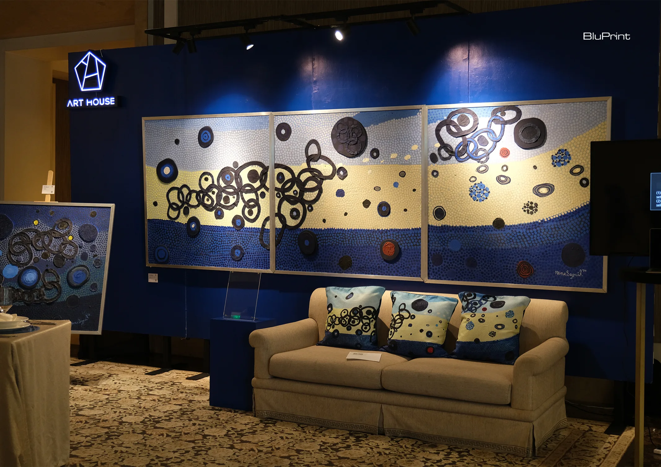 An image featuring the Art House's merchandise of Nena Saguil, and some of her works.