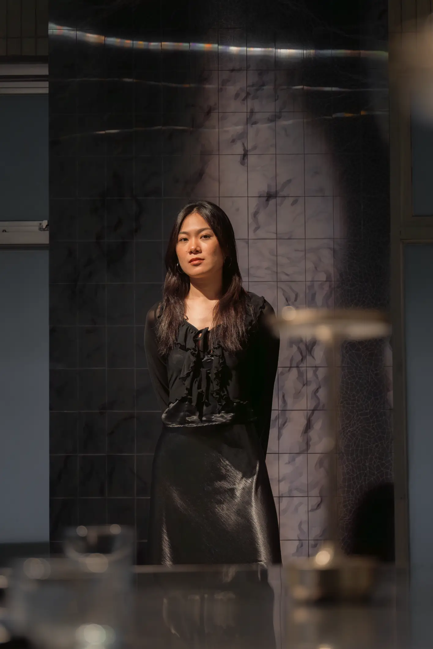 A portrait of Celine Lee in front of "A Mass." Photo by Joshua Misalucha, provided by Patrick de Veyra.