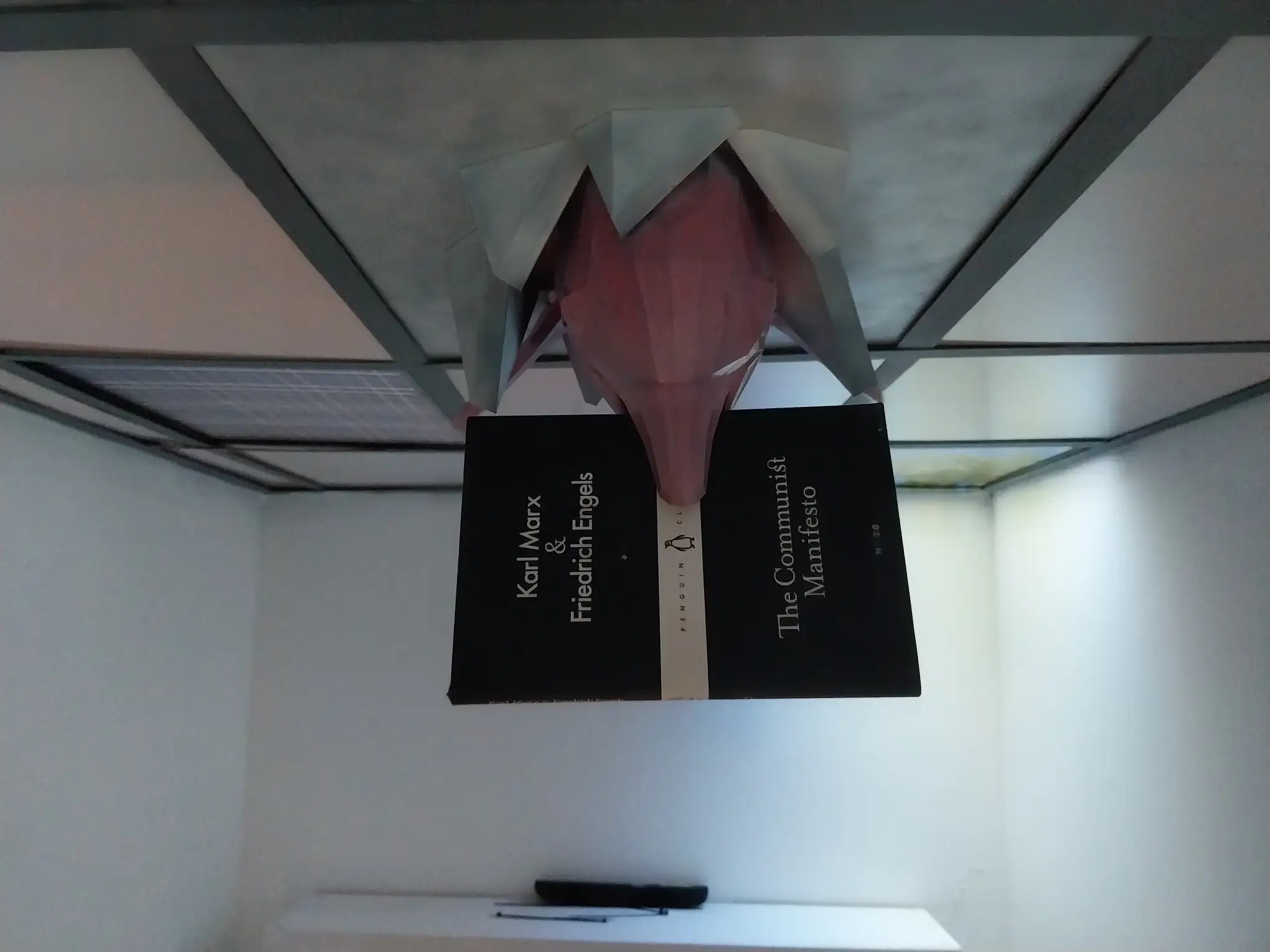 A dolphin with "The Communist Manifesto" for Jose Olarte's exhibit in Gravity Art Space. It is featured in our year-end roundup of art exhibitions.