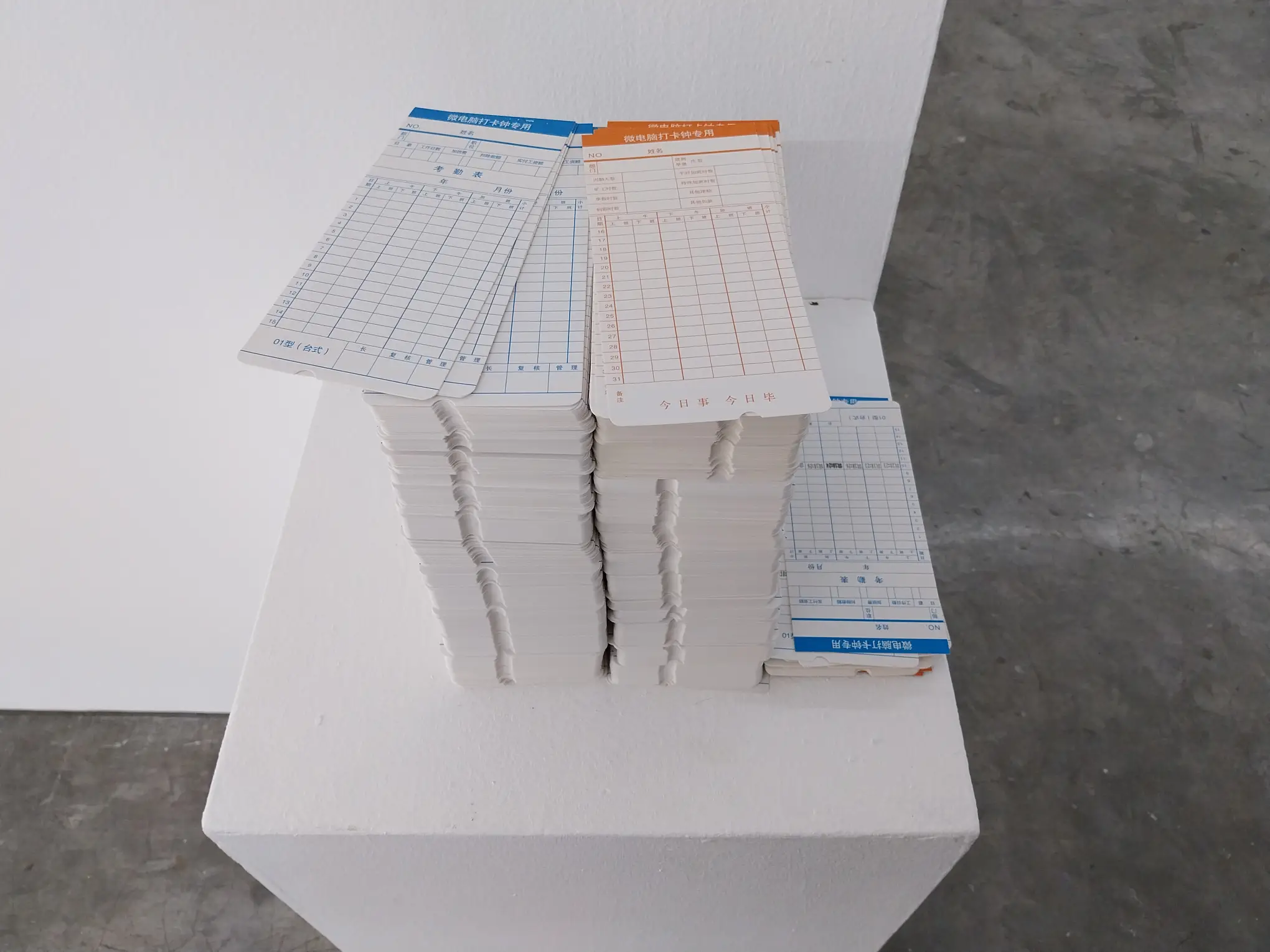 A pile of time cards, as shown in "Perimeters."